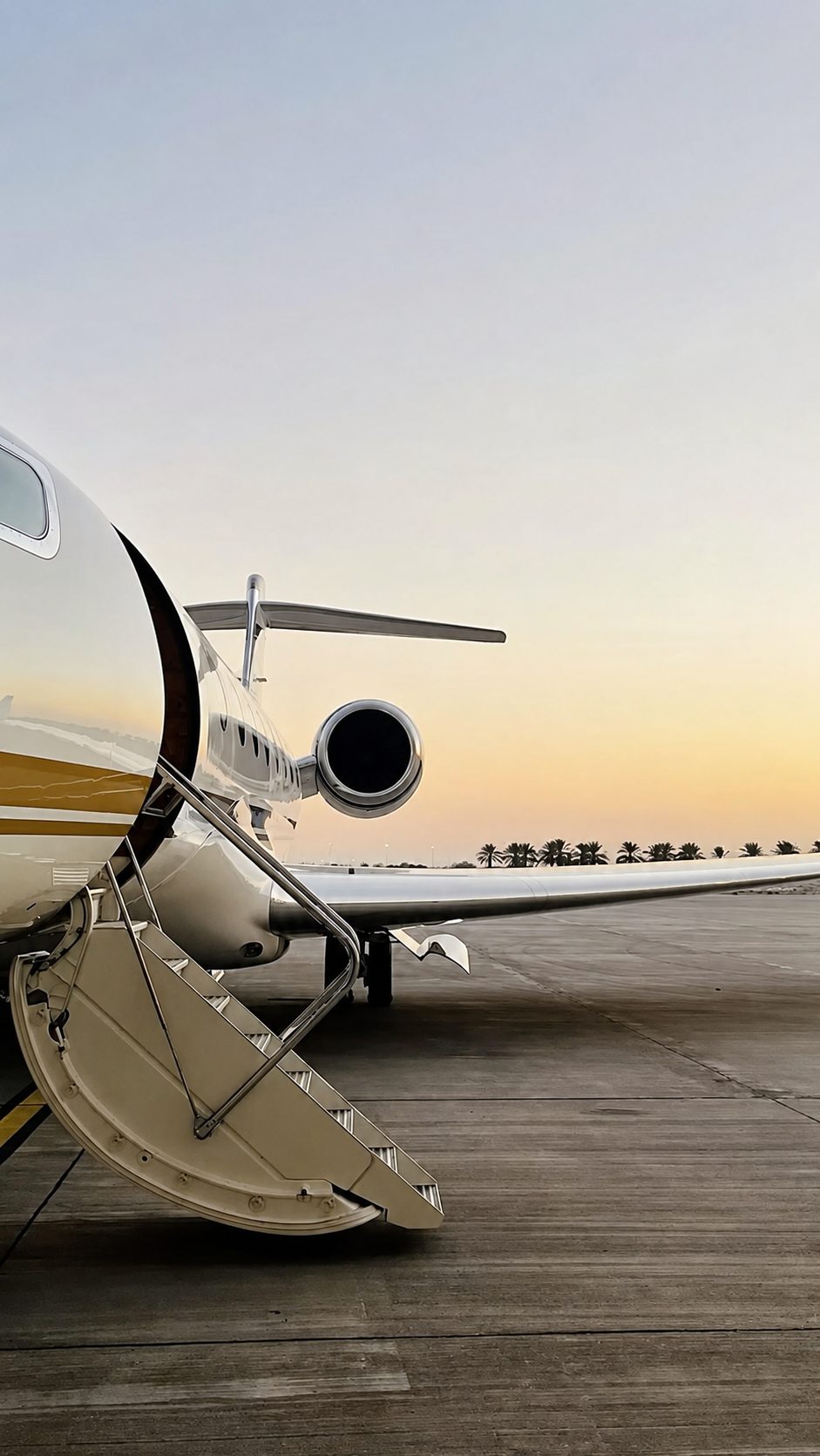 Polished private jet with boarding stairs on a South Florida airport ramp